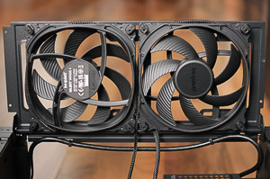 "The two 140mm fans on the side door. The left fan (case bottom) is an intake, and the right one is an exhaust. Note the wiring routed around the fan frames."