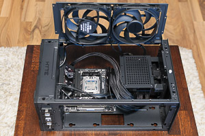 "Motherboard power cables, 1st attempt: not great, not terrible. Very tight against the CPU cooler."