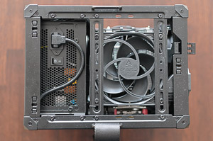"Top view without the panel, showing the PSU power cable and the top _Arctic P12_ exhaust fan. A lot of dust after stress-testing..."