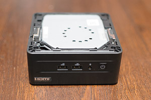 "The top lid removed, revealing the metal plate that blocks the air getting to the blower. Really, _Asus_? These tiny holes are enough for fresh air? And you also covered them with a plastic lid..."